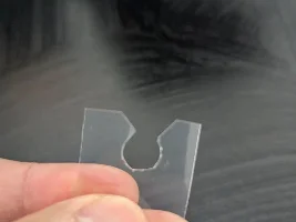 Gas cap retainer cord/disconnecting