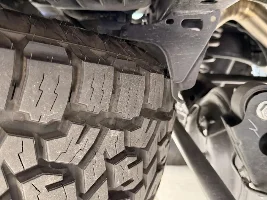 Largest AT tire that fits spare space of Premium+