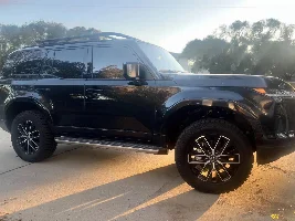 DIY Westcott Collars in driveway w/ floor Jack and stands. (Stock wheels on 33” Goodyear Wrangler ATs)